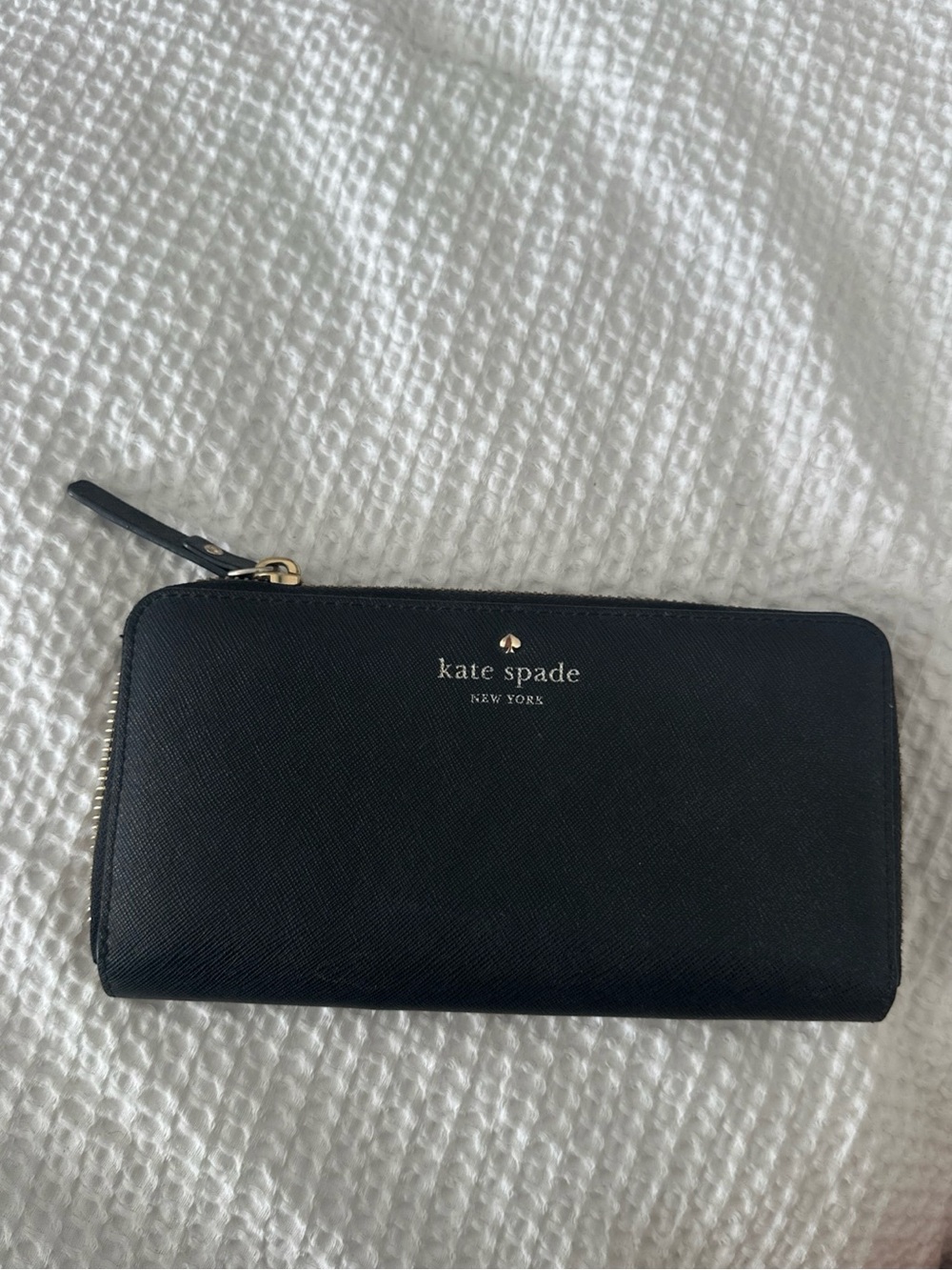 kate spade black zip-around Saffiano leather wallet with gold logo